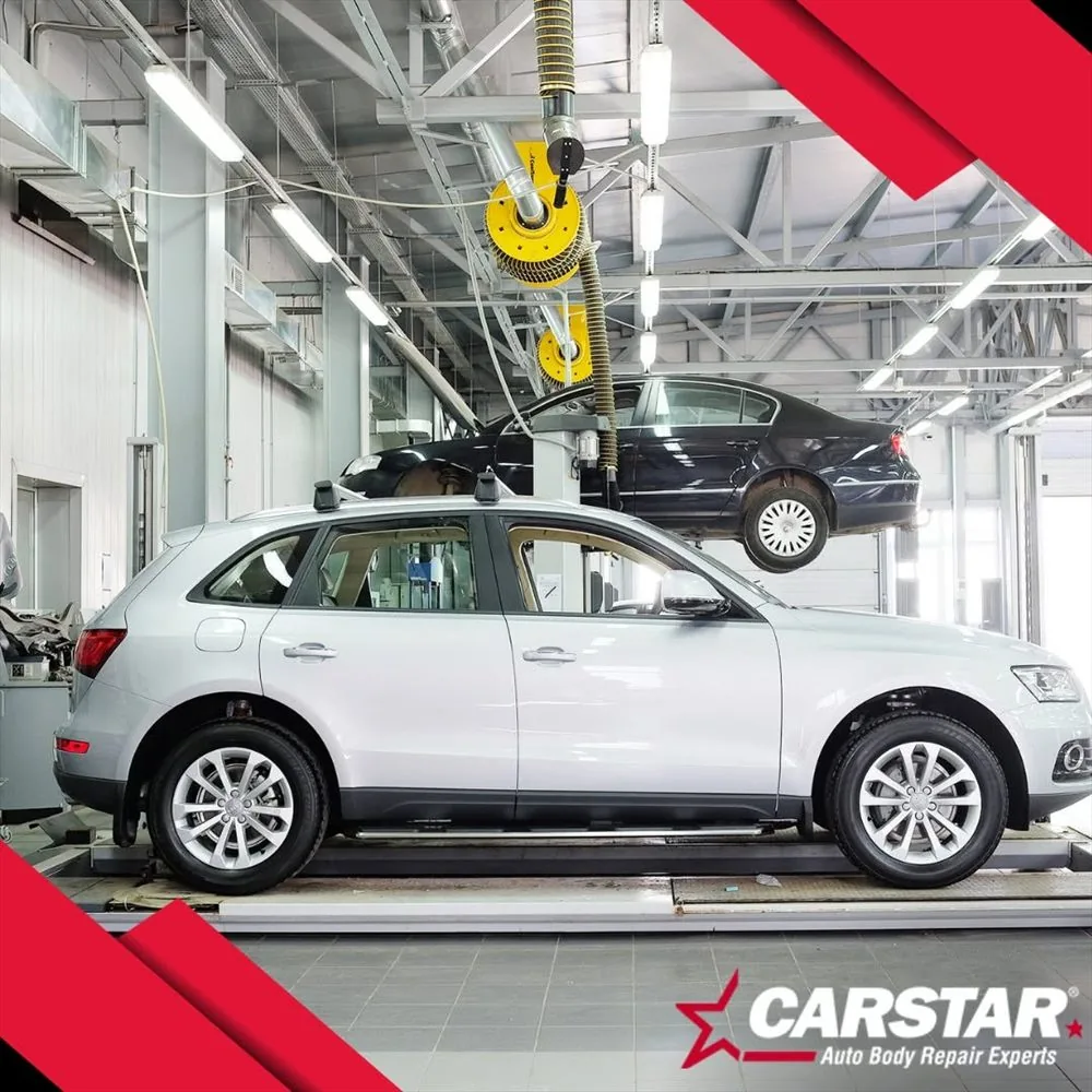A vehicle in a repair bay being assessed for damage