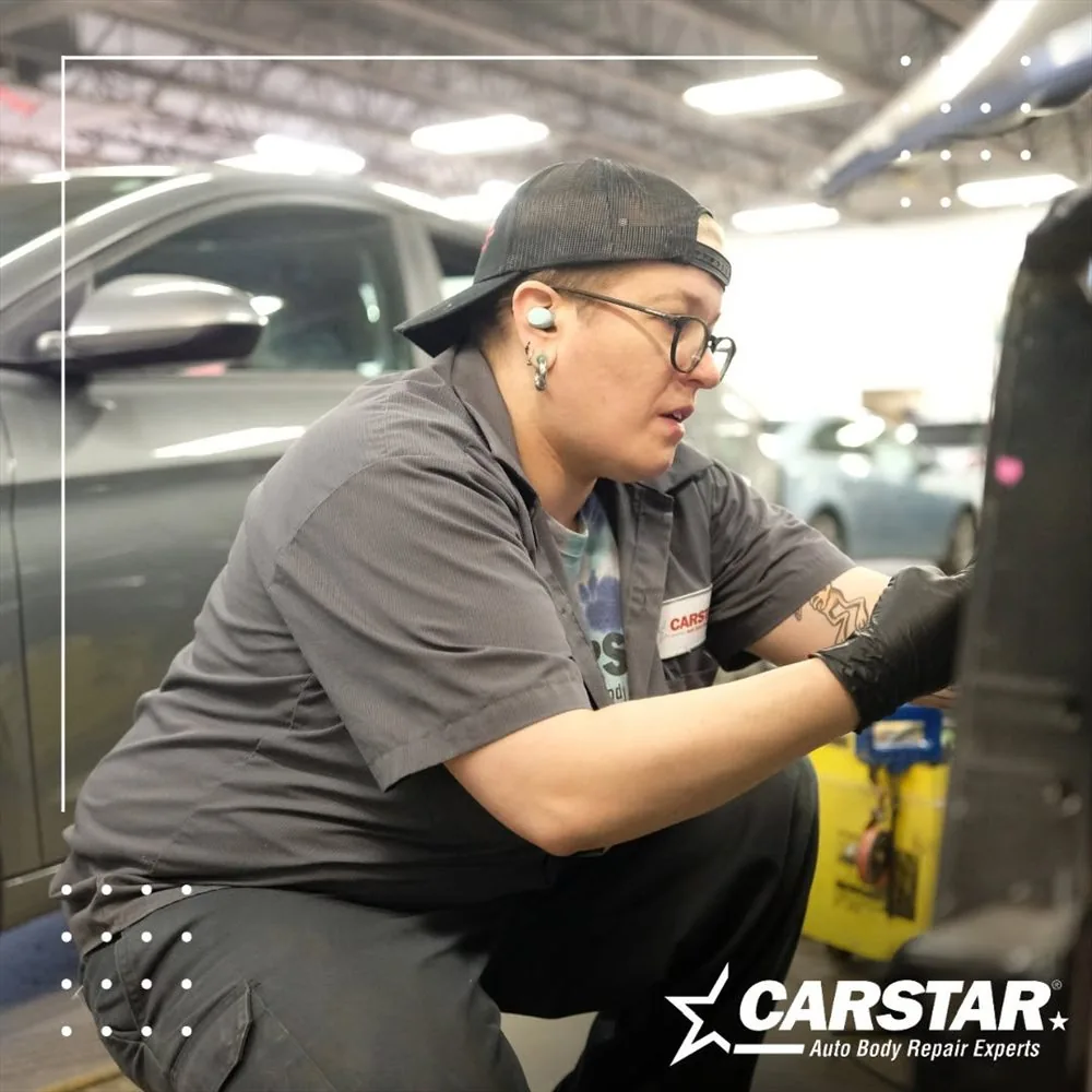 A Fix Auto Port Orchard technician working on a vehicle in the shop